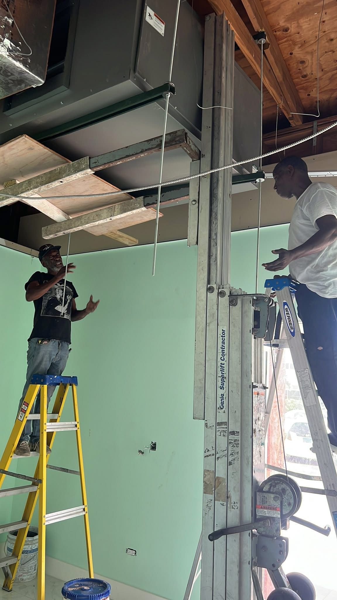 Bahamas AC Services team installing large commercial HVAC unit