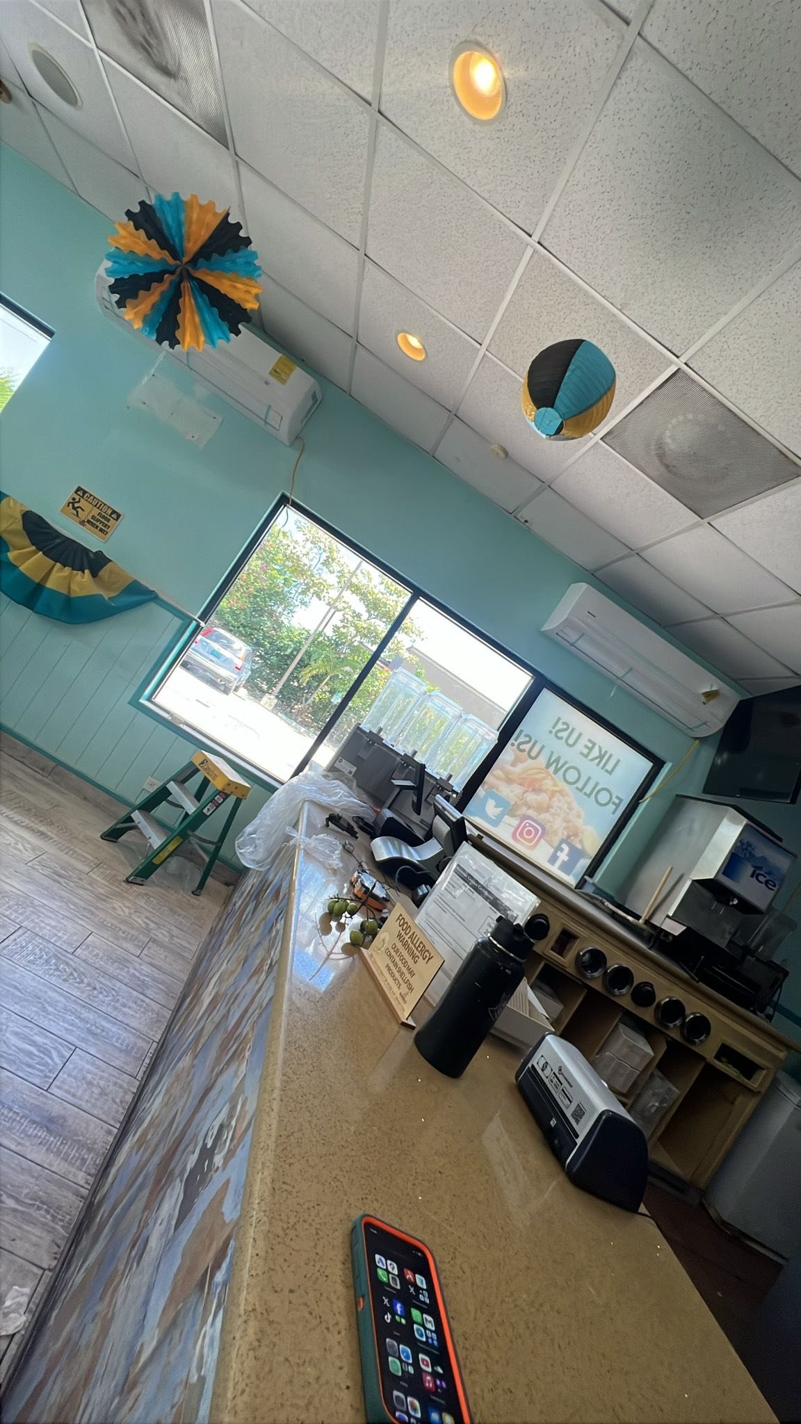 Wall-mounted AC units installed inside a Bahamian restaurant interior