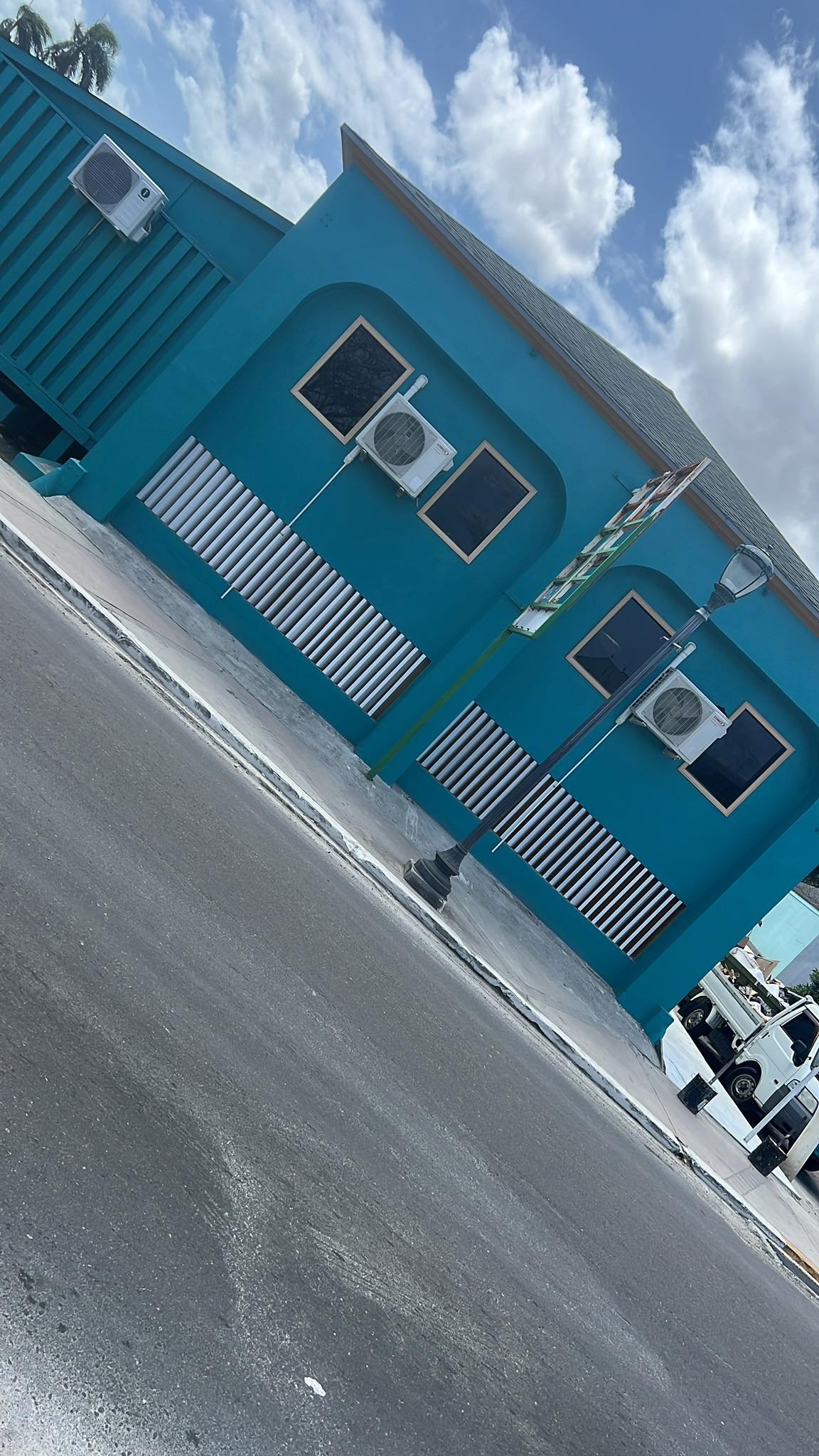 Two-storey building in Nassau with multiple newly installed AC units